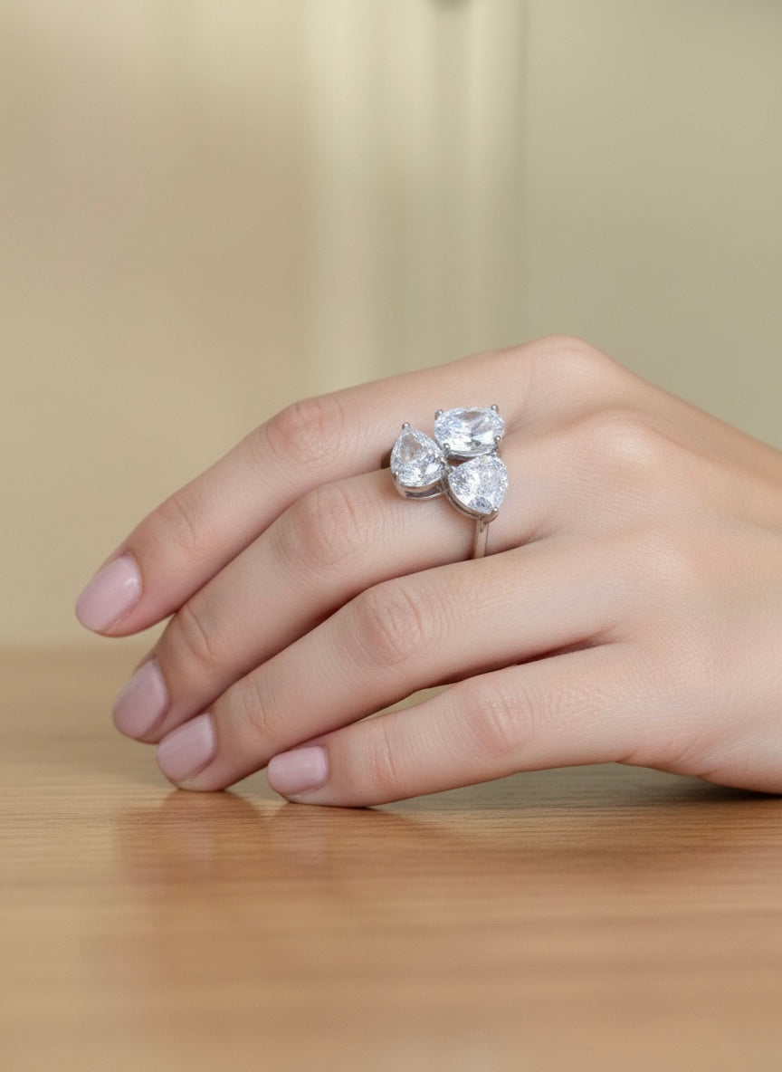 The Sistora Three-Stone Pear Ring