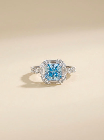 The Sistora 'Ocean Ice' Simulated Blue Diamond Halo Ring (925 Silver)