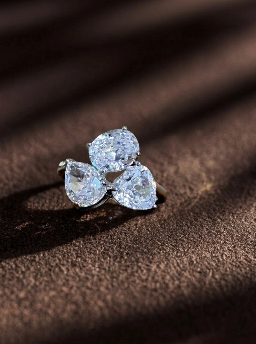 The Sistora Three-Stone Pear Ring