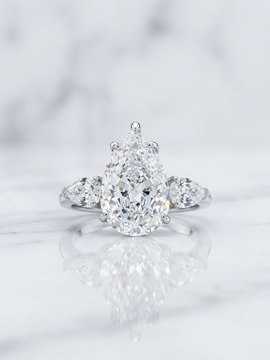 The Sistora 'Stellar Tear' D-Color Three-Stone Pear Ring (925 Silver)